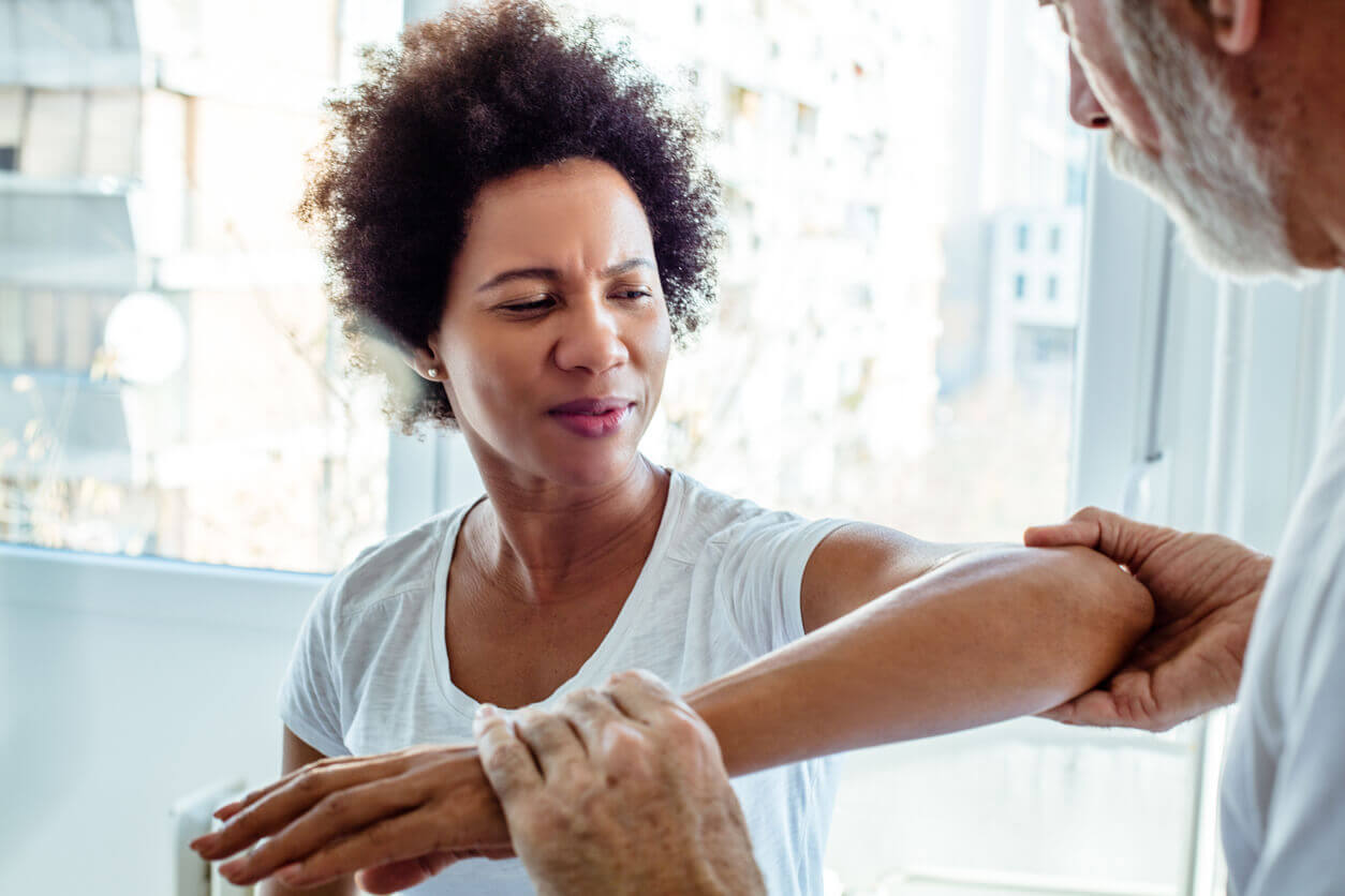 women with elbow pain due to injury
