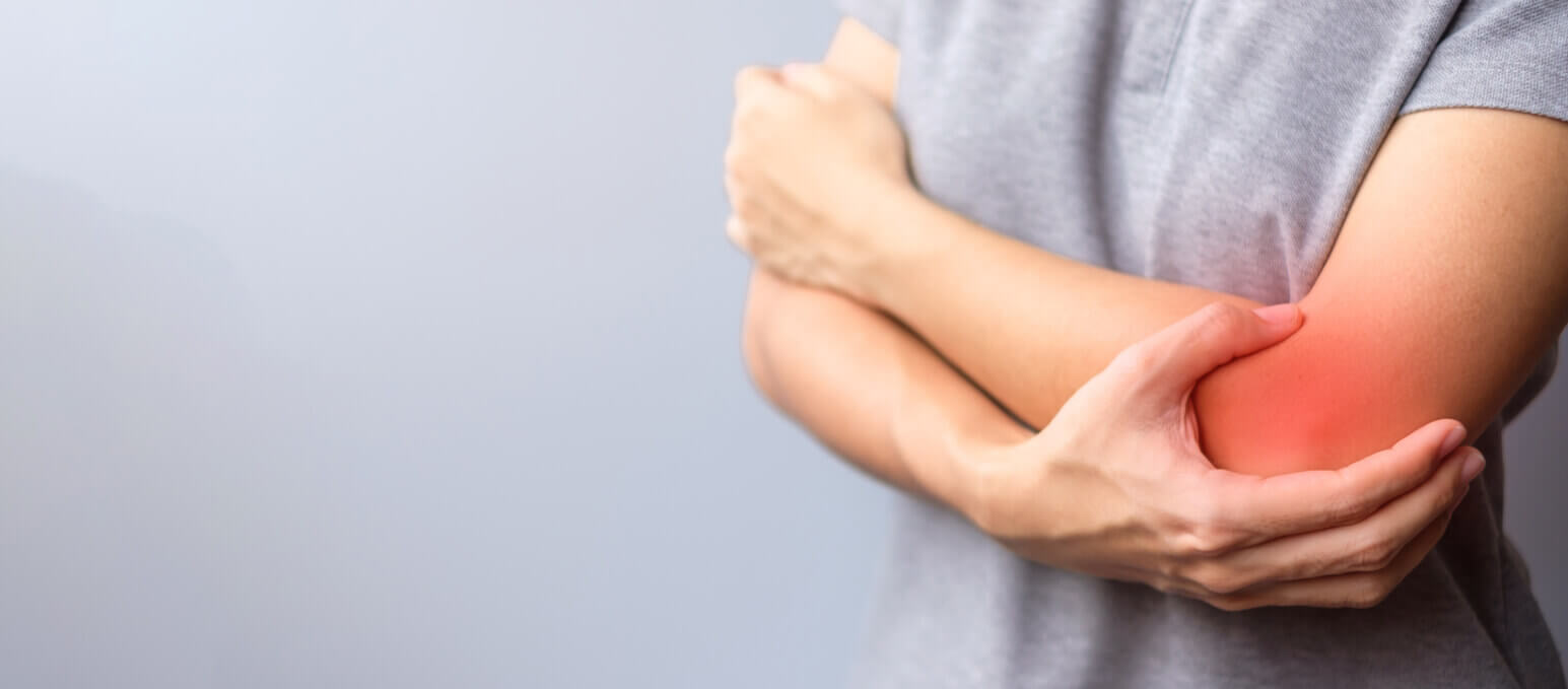 Woman having elbow ache due to lateral epicondylitis or tennis elbow